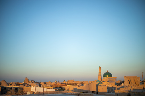 the panoramic view of a historical buildings and homes in the evening time inside the Fortress, Khiva, the Khoresm agricultural oasis, Citadel.