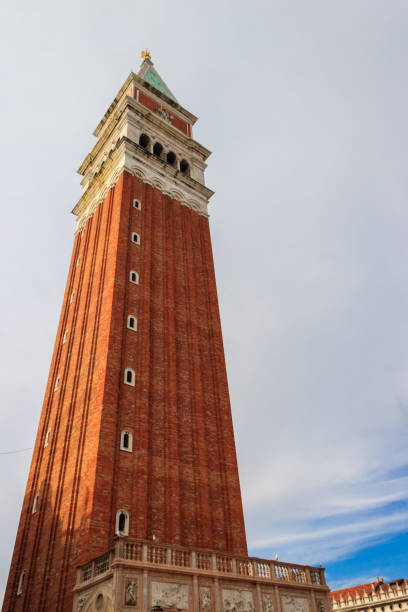 A wide shot of Venice's Campanile and Doge's Palace framed through an archway