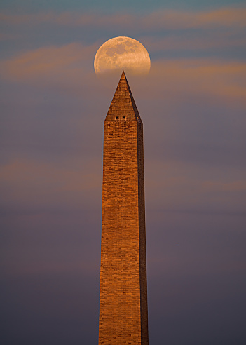 Moon rising behind the Washington Monument.