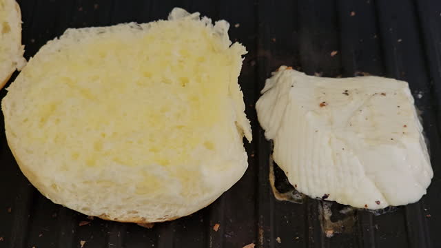 Preparing a white cheese sandwich in the toaster