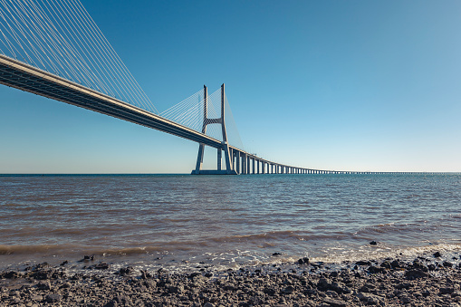 huge vasco da gama bridge in lisbon, portugal.