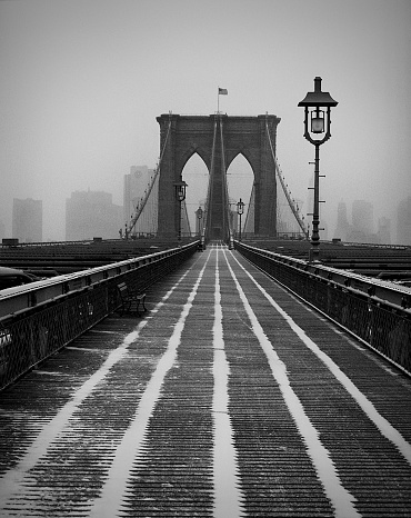 The majestic Brooklyn Bridge in New York brooklyn downtown skyline side view USA