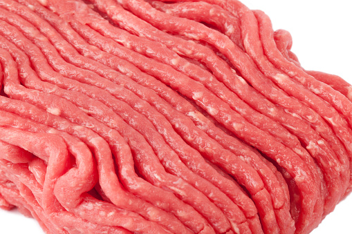 Raw ground beef close up isolated on white