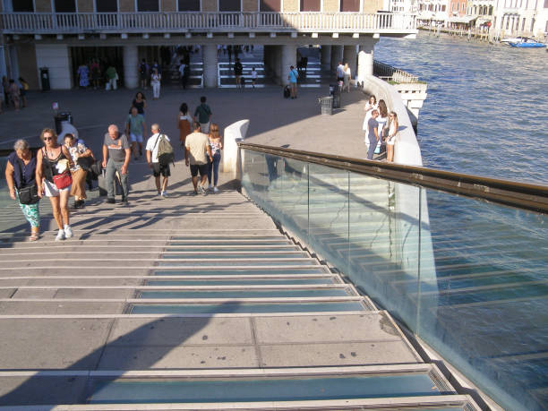 Venice, Italy - September 08, 2023: People on Ponte della Costituzione translation Constitution Bridge over Grand Canal designed by Santiago Calatrava