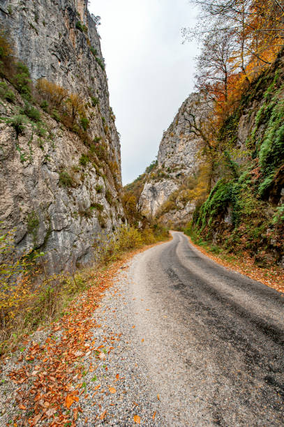 istock Village road passing through the valley 2073677922