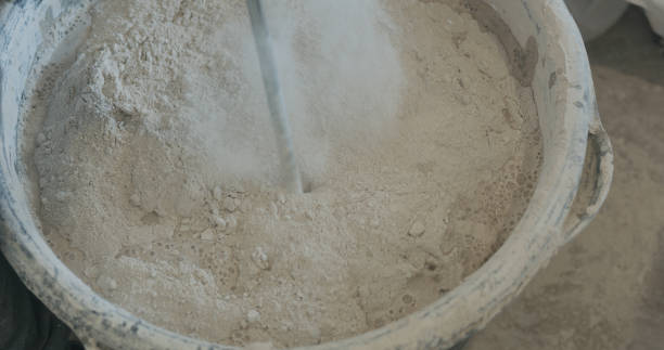 istock mixing concrete plaster with electric mixer 2073686210