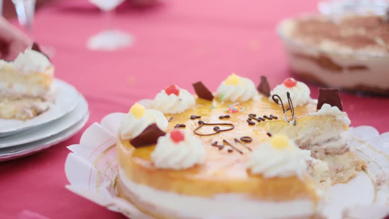 Cropped video of people cutting and eating sweet delicious cakes at table