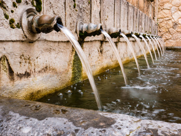 istock An ancient stone water fountain 2073700768