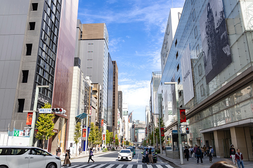 Tokyo, Japan - October 13, 2023: The crowded and busy streets of the famous Chuo-dori high end fashion shopping street of Ginza, in Tokyo, Japan