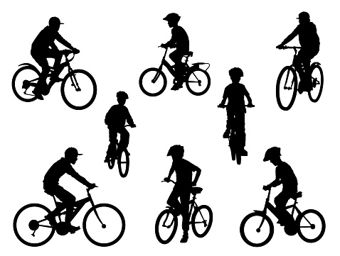 Silhouettes with kids on bikes