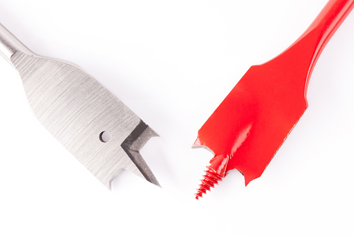 different types of spade drill bits on white background
