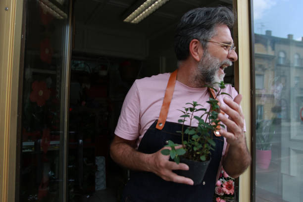istock Mature worker in flower shop 2073801695