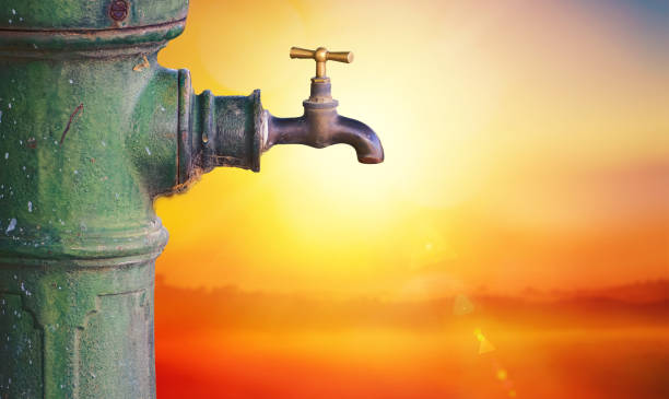 Concept of drought and climate change. Waterless fountain under a scorching sun. (1)