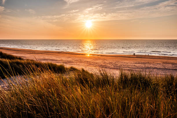 istock Beautiful sunset at the beach and sea 2073837748