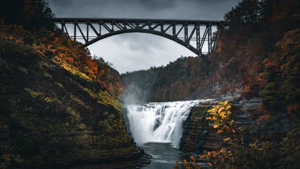 istock River flow and fall with vibrant color in a cloudy day during autumn season 2073840350