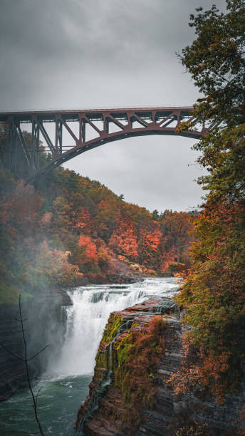 istock River flow and fall with vibrant color in a cloudy day during autumn season 2073840356