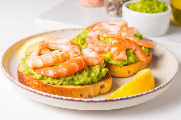istock Shrimps on toast with avocado and lemon. Breakfast concept. Bruschetta. 2073858803