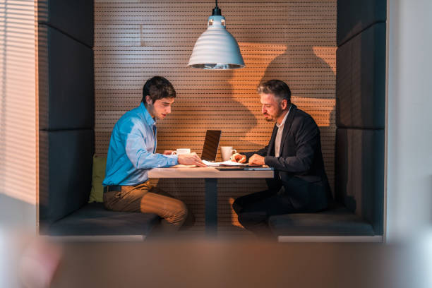 istock Focused Diverse Business Colleagues Discussing Project Indoors 2073859121