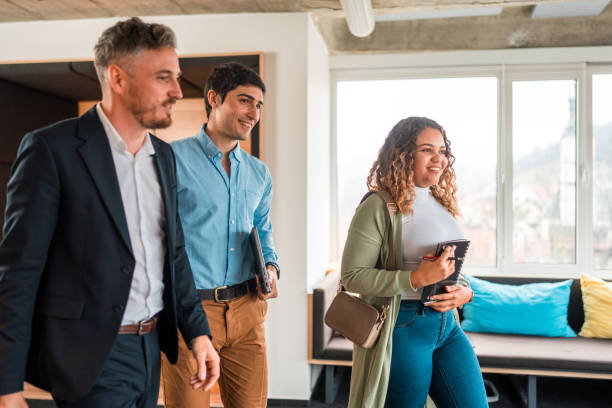 istock Diverse Business Professionals Walking in Modern Office 2073859414