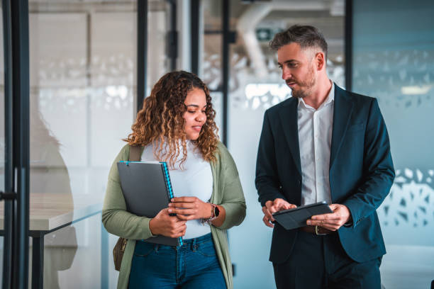 istock Professional Diverse Business Colleagues Walking in Office 2073859419