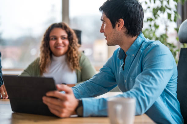 istock Diverse Business Colleagues Using Tablet in Office Meeting 2073859965