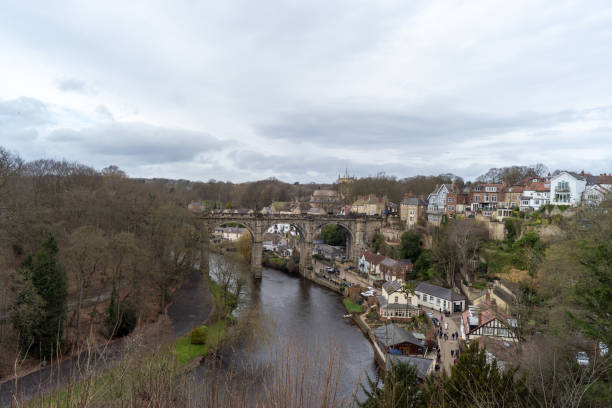 istock River running alongside urban cityscape 2073890352