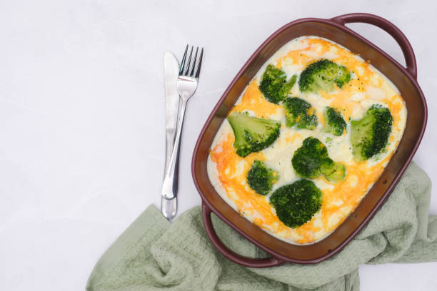 istock Quiche broccoli. Egg Frittata ready for baked. Baked egg frittata with spinach, cheese, broccoli, milk. Served on grey background.. 2073901320