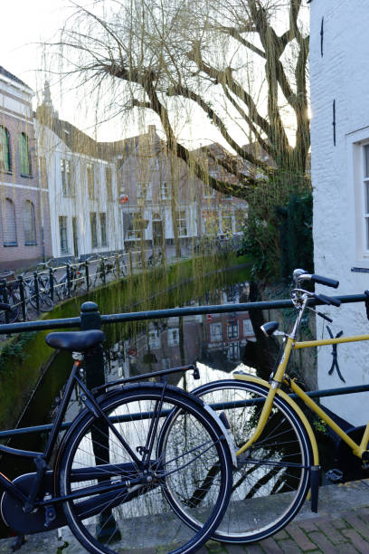 istock Bikes in front of reflective canal in Amersfoort, Netherlands. 2073953118
