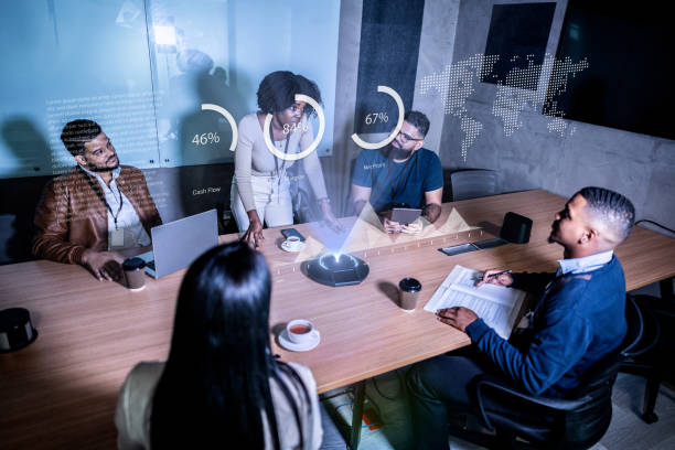 istock Coworkers using augmented reality device during a meeting at office 2073953642