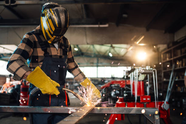istock Dedicated worker welding a big metal construction with great caution. 2073955250