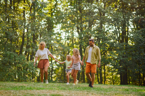 istock A cheerful parents with their children spending time in nature. 2073957901