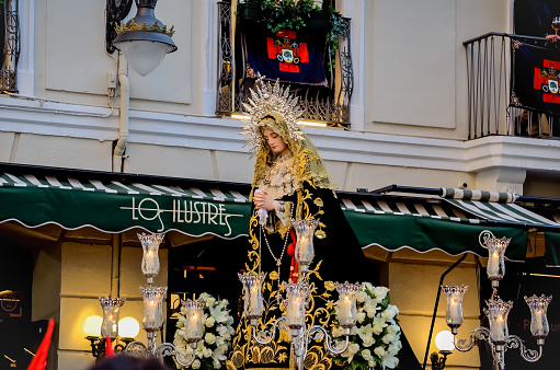 Holy Week Procession on Holy Thursday with the Paso Nuestra Señora de la Piedad. tours the center of Valladolid. Valladolid, Spain - April 14, 2022.