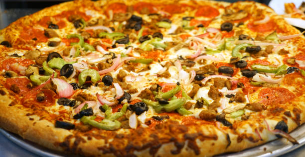 istock close up on fresh baked pizza 2073974351