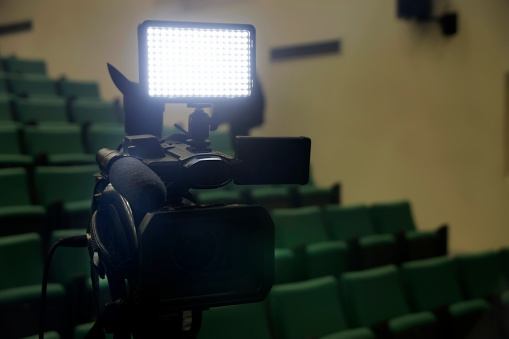 Professional Video camera   - TV cam and flash light in a conference