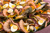 Paella. Traditional Spanish food, pan-seared seafood paella with mussels, prawns and squid.