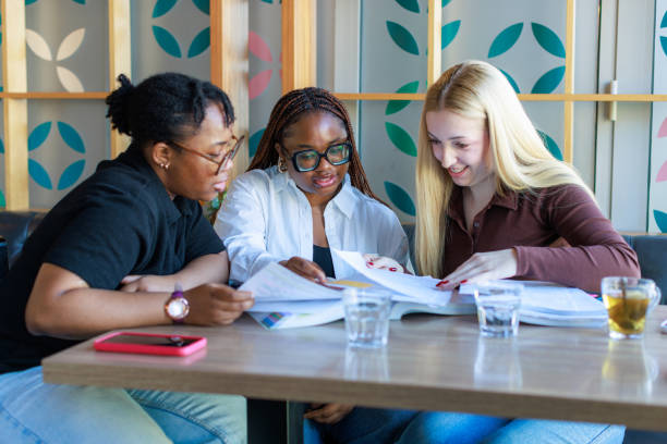 istock Friends studying together in the Cafe 2073994182