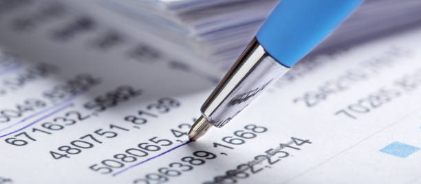 istock Accounting document with pen, share listing and checking financial chart. Concept of banking, financial report and financial audit. 2074018838