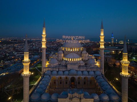 Happy Ramadan Feast Text in the Suleymaniye Mosque, Illuminated Letters Between Minarets (Mahya) Drone Photo, Suleymaniye Fatih, Istanbul Turkiye (Turkey)