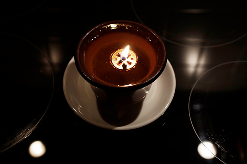 Red Candlestick on a small plate