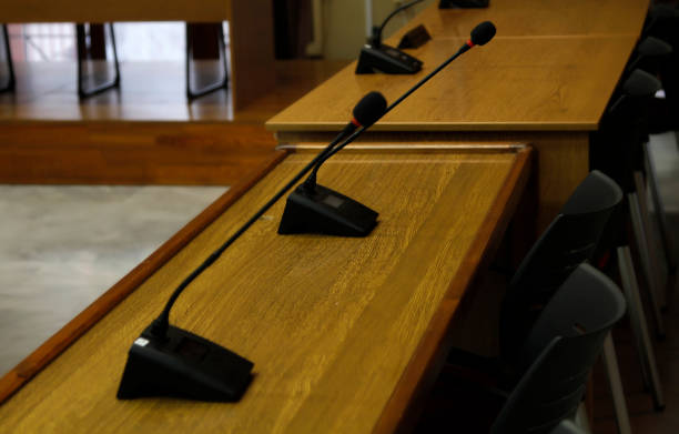 istock Microphones in conference-meeting room 2074049626