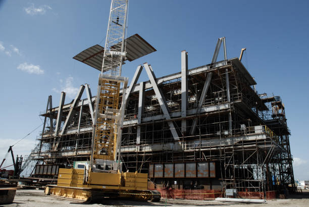 istock Crane working on building modules for oil and gas platforms. 2074070737