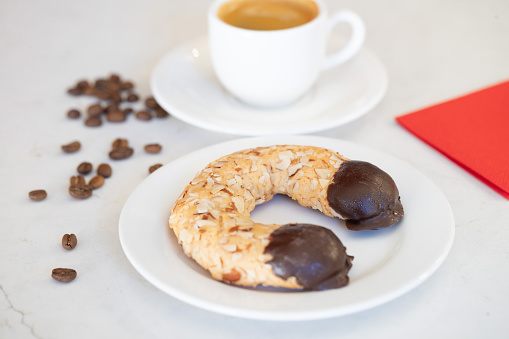 Chocolate dipped Horseshoe Cookie and Coffee