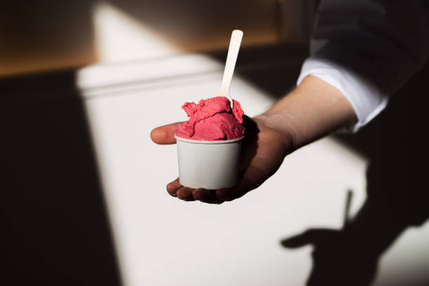istock Scoop of Cherry Gelato in a cup with shadow 2074073879