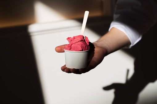 Scoop of Cherry Gelato in a cup with shadow