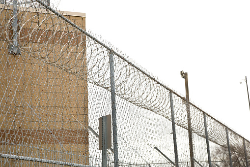 Barbed wire fence with German watchtower border