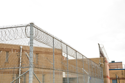 County jail razor wire security precautions to keep inmates in.