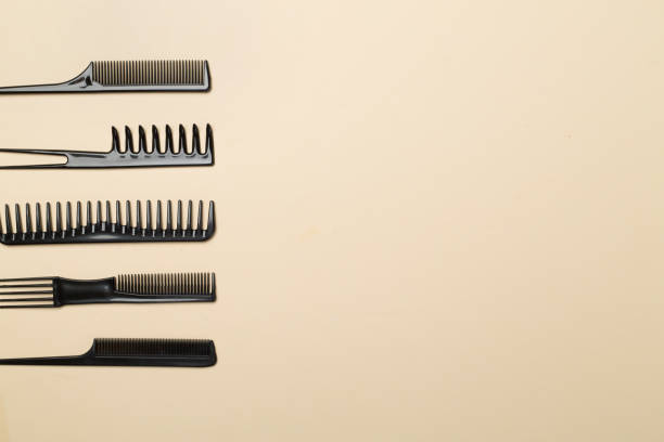istock Professional combs and hairdresser tools on color background, top view 2074174516