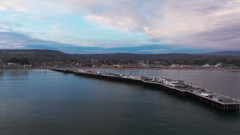 Aerial drone shot flying in towards santa cruz, California over the ocean