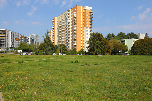 Warsaw, Poland - September 13, 2023: Apartment blocks in the middle of nature on a sunny day as part of the Goclaw housing estate in the Praga-Poludnie district.
