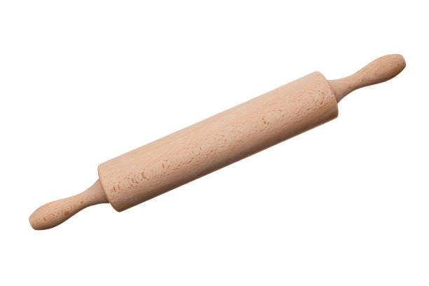 Wooden rolling pin view diagonally isolated on white background closeup.